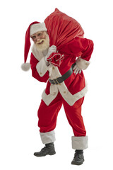 Senior male actor old man with a real white beard in the role of Father Christmas.