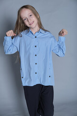 Delightful expression with heart-shaped hands, in soft blue. Reflects the warmth and positivity in children s fashion.