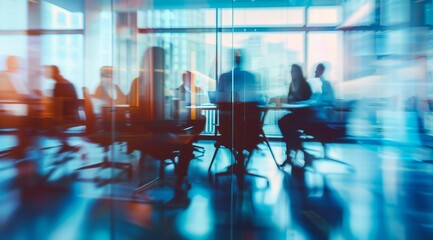 A blurred group of business people are having a meeting in a mordern office