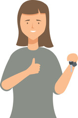 Young woman is holding a new car key and showing a thumbs up gesture