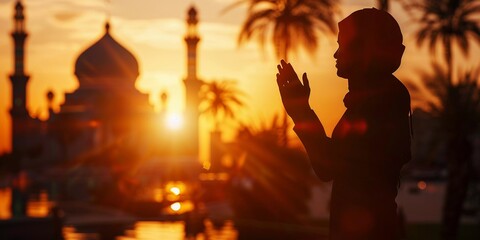 Faithful Silhouette: Prayers Echo at Sunset Mosque (Ramadan, Islam)