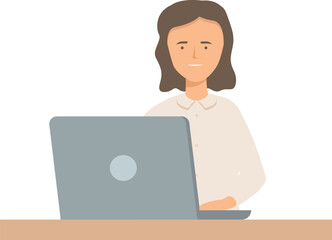 Young office worker is sitting at a desk and working on her laptop