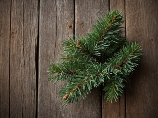 Naklejka premium Pine branch, vibrant green needles spread out, rests against rustic wooden background. Brown pine cones nestle within needles. Organic texture contrasts with crafted wood, creating serene scene.