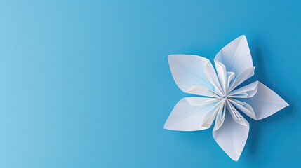 Blue background with an origami flower