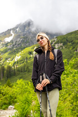 Naklejka premium beautiful girl hiking in the Polish mountains during the summer day