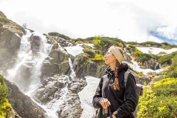 beautiful girl hiking in the Polish mountains during the summer day