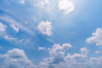 Fototapeta premium clear blue sky background,clouds with background, Blue sky background with tiny clouds. White fluffy clouds in the blue sky. 