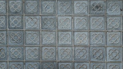 Decorative concrete wall tiles with vintage floral patterns, suitable for architectural backgrounds and interior design themes  Spain Barcelona