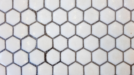 White hexagonal ceramic tiles pattern for modern interior design background, related to home improvement and contemporary architecture
