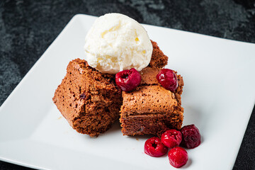 brownie with ice cream and cherries