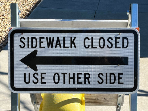SIDEWALK CLOSED - USE OTHER SIDE sign