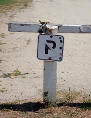 Old faded small NO PARKING sign