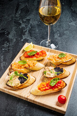 different canape on the wooden tray