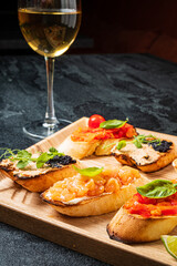 different canape on the wooden tray