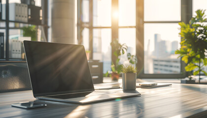 Openned Laptop on a Desk in a Modern Office. Sunlight Streams Through Windows