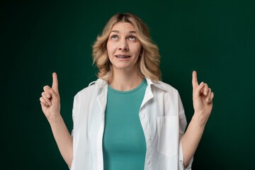 Woman in Green Shirt Holding Hands Up