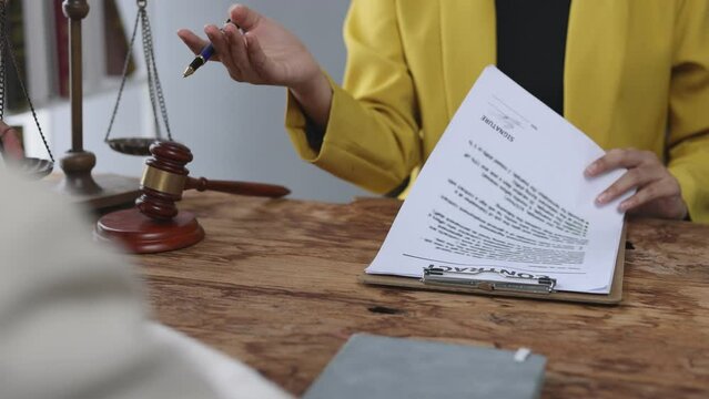 Lawyers are discussing legal terms at a contract signing meeting. Lawyers are negotiating an agreement to mediate the parties' dispute.