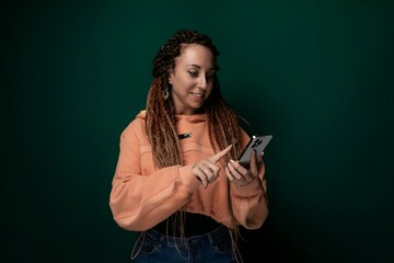 Woman With Dreadlocks Using Cell Phone