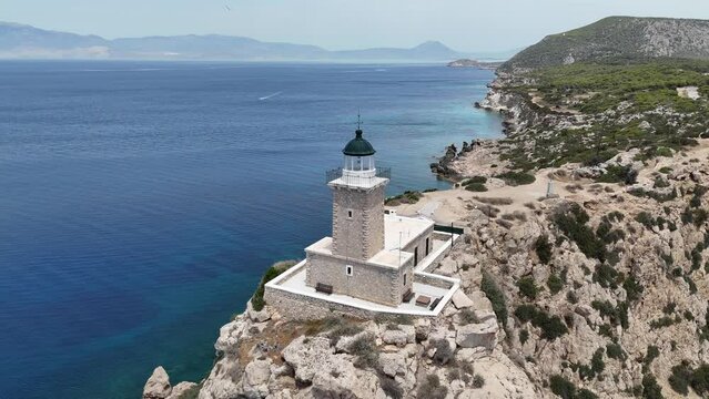 Aerial drone photo of beautiful and picturesque cape Melagavi forming a small peninsula with unique lighthouse stand out next to archaeological site of Heraion, Loutraki, Greece