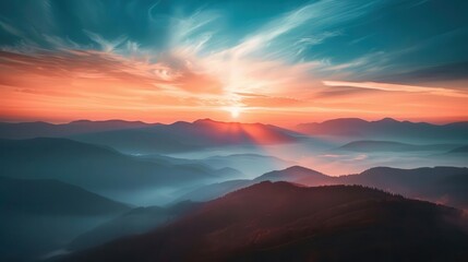Fototapeta premium majestic sunset over misty mountain range with dramatic sky landscape photography