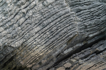 Amazing hillside cliff with compressed layer rock structure or call Pancake rock in the nature geological. 