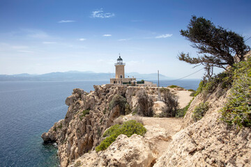 Aerial drone photo of beautiful and picturesque cape Melagavi forming a small peninsula with unique lighthouse stand out next to archaeological site of Heraion, Loutraki, Greece