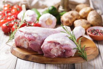 fresh turkey meat with rosemary and ingredients for cooking