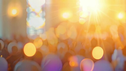 Defocused sunlight casts a golden hue over the congregation as they worship under the blue sky.