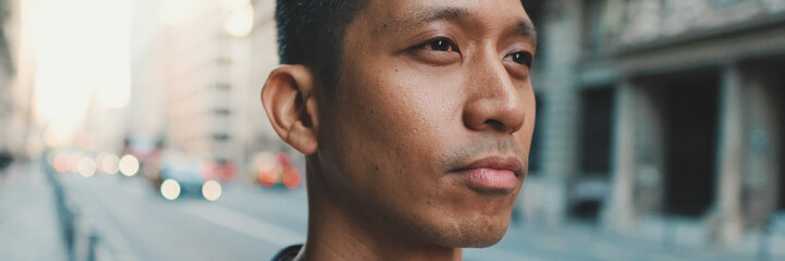 Obraz premium Young man standing next to the road