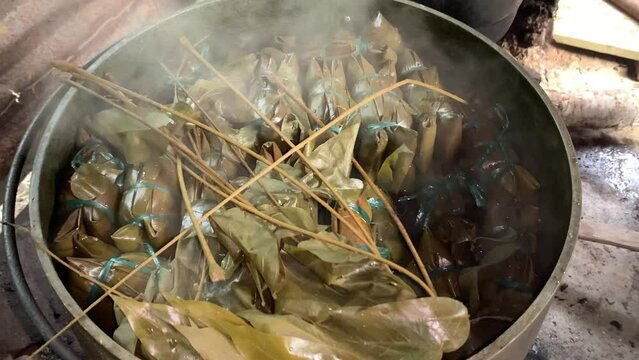 Buras or Burasa, Bugis Makassar food made from coconut milk rice wrapped in banana leaf and boiled. Traditional kitchen in rural life.