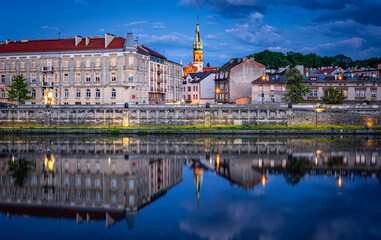 Panorama of Podgorze district in Krakow, Poland with beautiful reflection in Vistula river during...