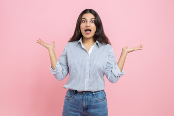 Shocked Indian woman spreading hands