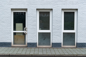 Fototapeta premium white house wall with even windows