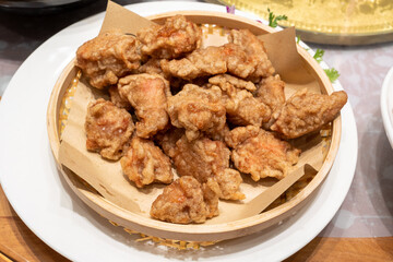 A plate of fried chicken. The chicken appears golden brown and crispy, making it look very appetizing.