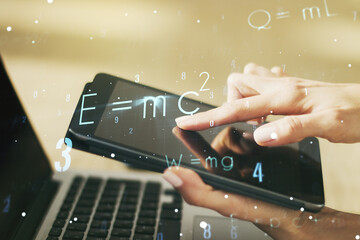Creative scientific formula illustration with finger presses on a digital tablet on background,...