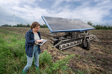 Farmer controls autonomous agricultural machine powered by solar energy