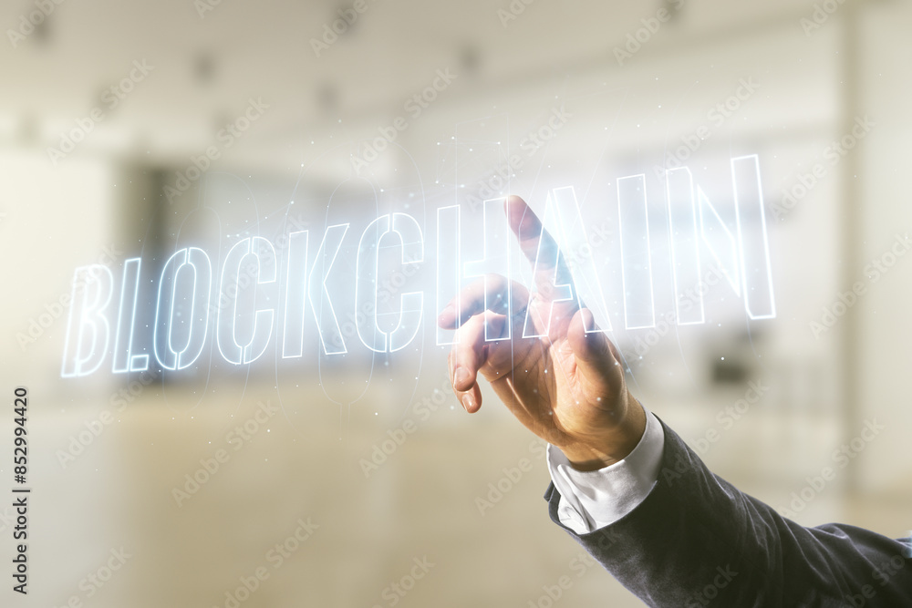 Aufkleber male hand clicks on abstract virtual blockchain technology sketch on blurred office background, futu
