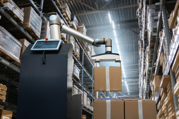 Robot arm moves boxes in an automatic warehouse