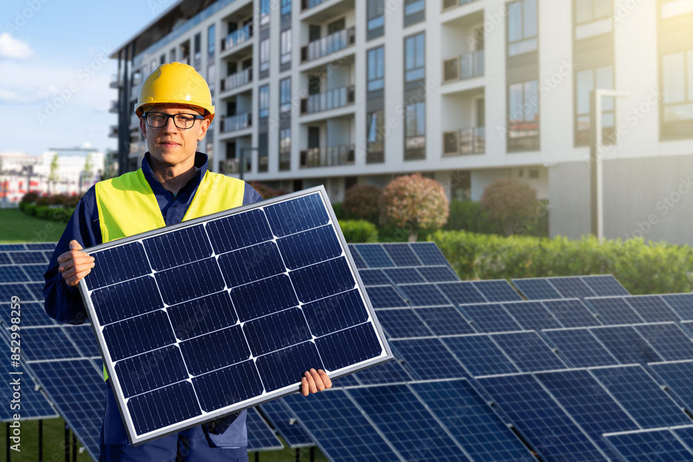 Aufkleber worker with solar panel on a background of solar power stantion