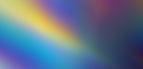Abstract blurred blue background with a soft spot of yellow light.