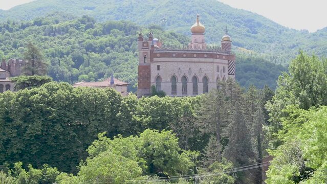 The ancient Rocchetta Mattei surrounded by greenery, Savignano, Grizzana Morandi, Italy