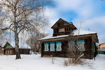 Wooden village houses on a cold winter day