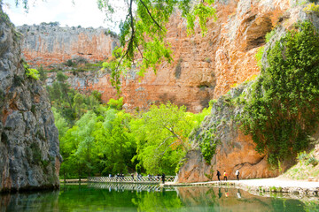 lake with greenish waters at the bottom of a limestone canyon in the area known as stone monastery