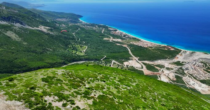 Aerial view of a paraglider over the Llogara landscape in the coast of Vlore, southern Albania. 