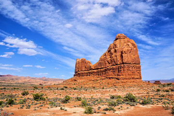 Arches National Park towering butte under soaring skies, Utah, USA