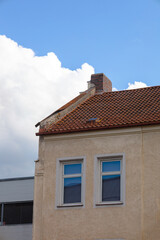 Brick chimney on tile roof