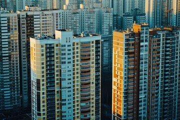 Obraz premium Multi-storey buildings with apartments. Construction of a new residential complex and new buildings. City district. Real estate concept