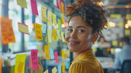 A diverse group of professionals engaged in a creative brainstorming session, using colorful sticky notes on a glass wall in a modern office. The team includes individuals of different ages and