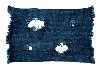 Piece of torn denim on a white background. Denim texture