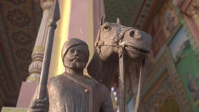 Close up Shot of a statue in front of Patrika Gate